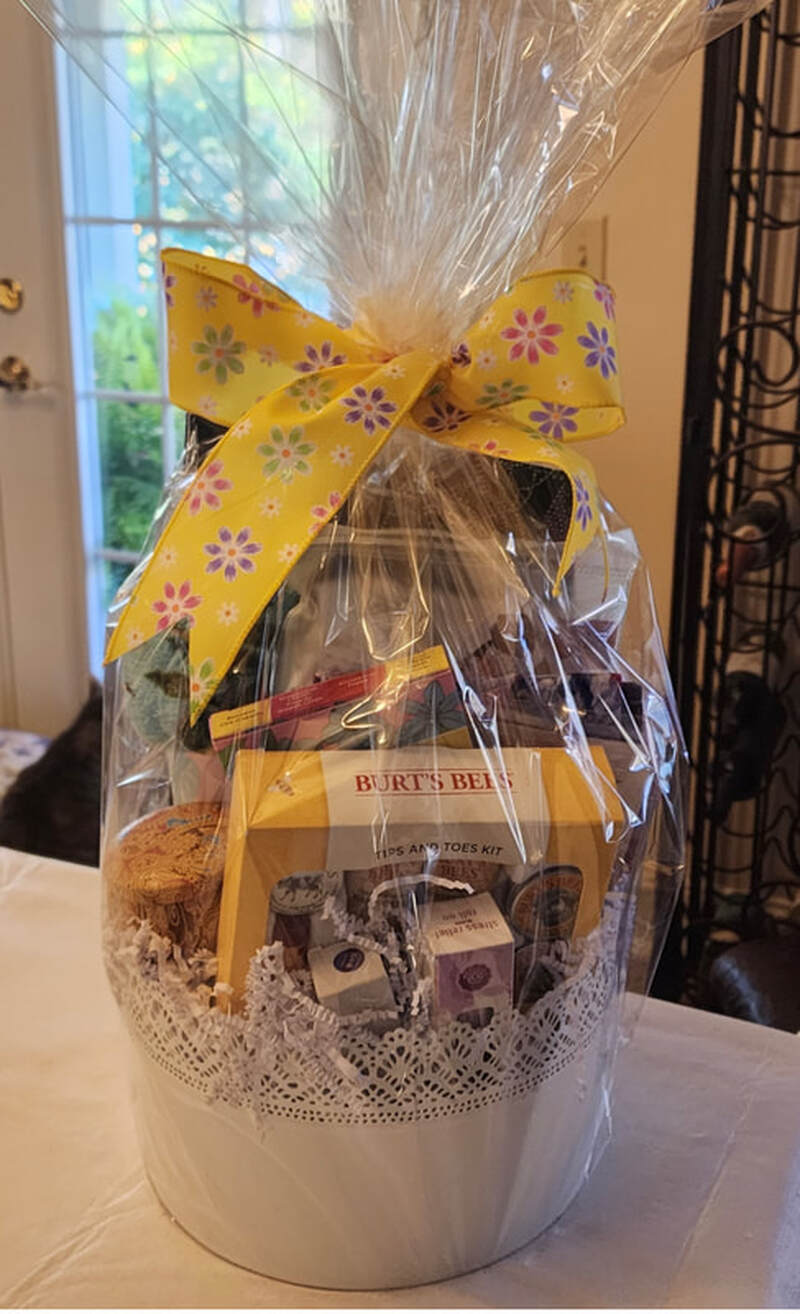 Raffle prize #12: Bert's Bees basket: Candle, cosmetic bag, roll on stress relief, and more