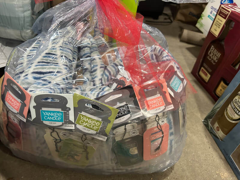 Raffle Prize #5: Large Yankee Candle, assorted Yankee Candle car jars, warm fleece blanket, bottle of wine