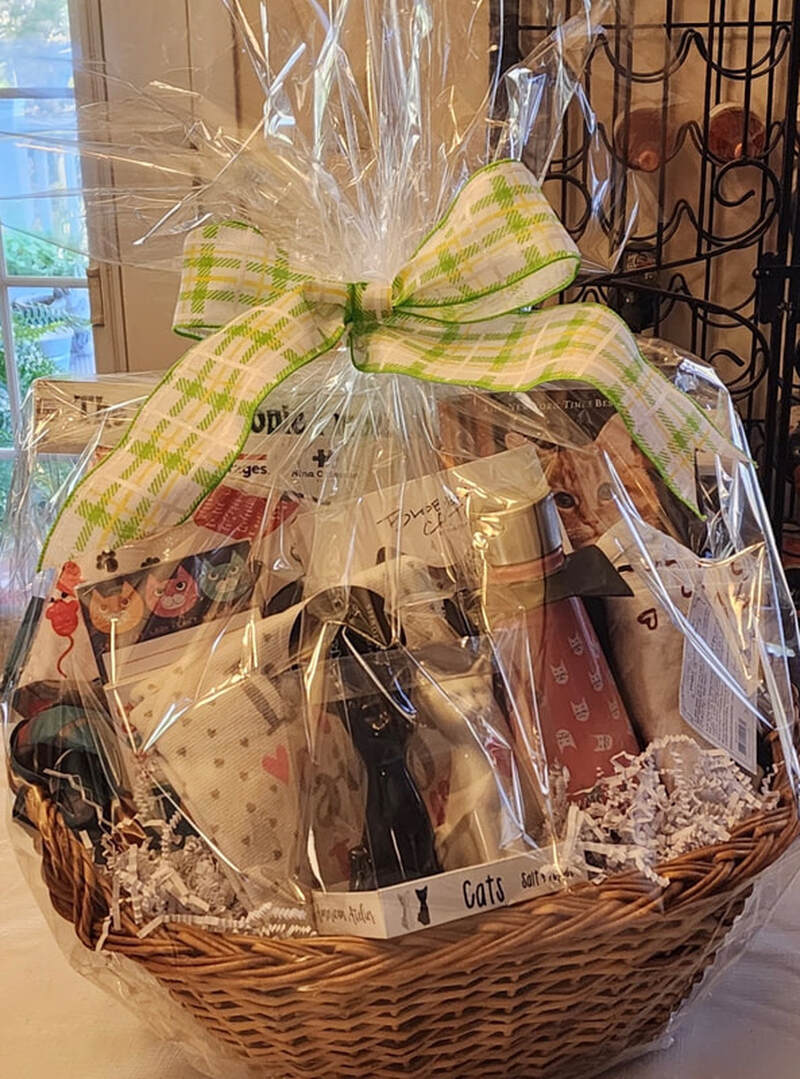 Raffle prize #13: Cat lover basket: Puzzle, stationery, thermos, salt and pepper shaker, and more